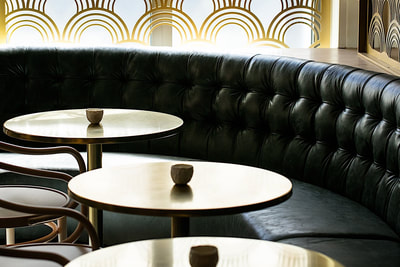 leather booths and round tables at Gibson